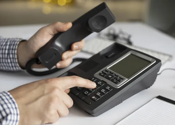 close-up-businessman-dialling-phone-number.jpg